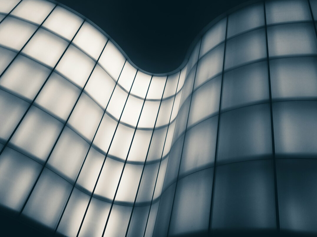 Futuristic curved LED volume studio with abstract light