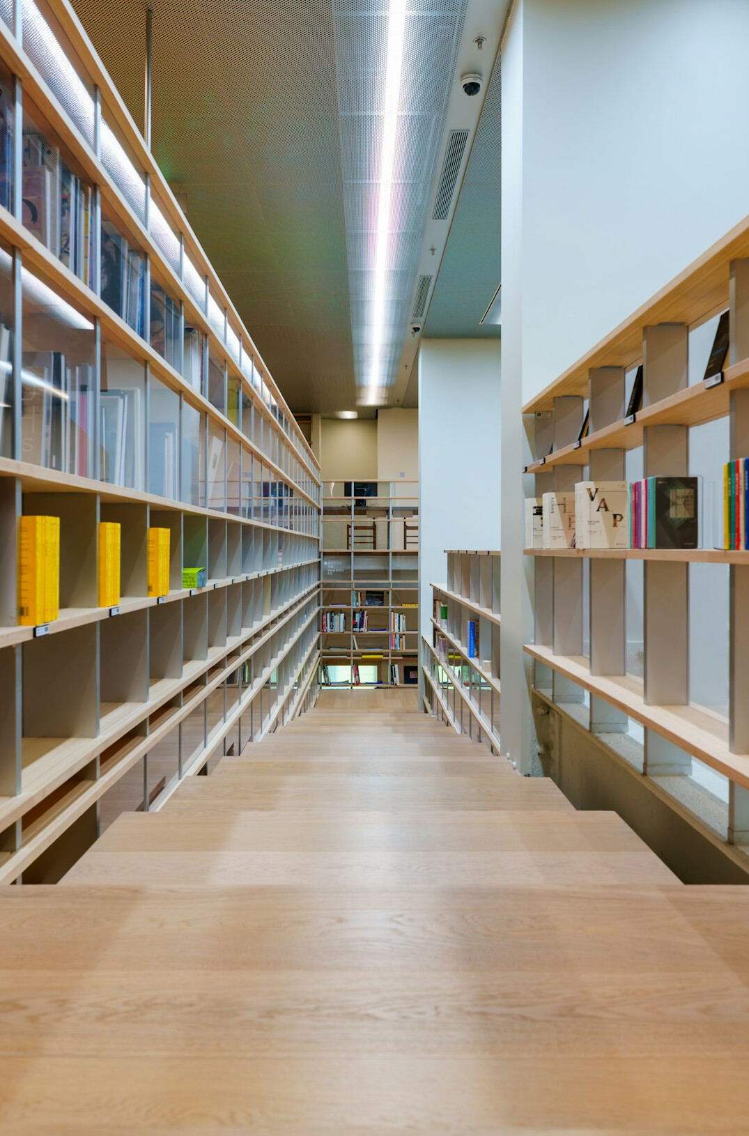 Archive reading room with long wooden table and documents