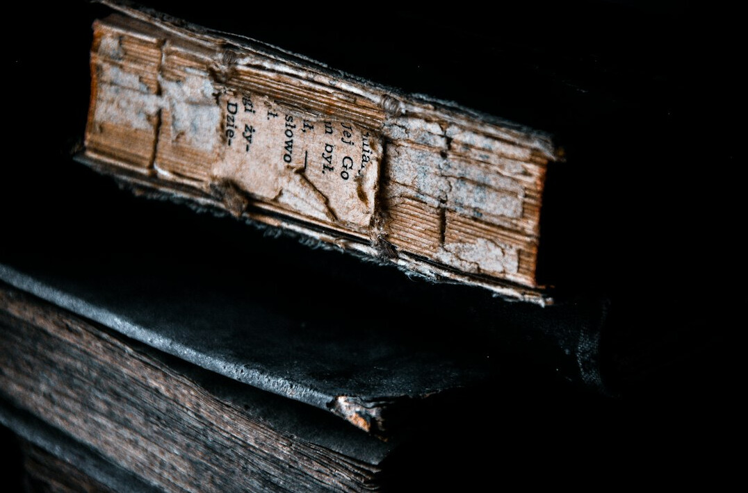 detective reading old book