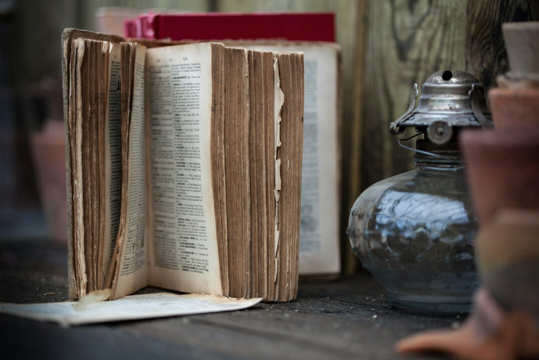 detective reading old book